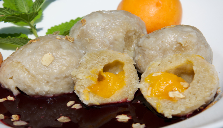 Vegan apricot dumplings with elderberry sauce